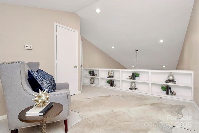 Versatile loft space is perfect blend of functionality and charm. Built in bookshelves make an ideal spot for storage or displays whether you envision the space as a home office, cozy library, play area or creative retreat. | Image 11