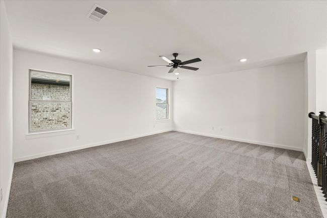 Carpeted empty room with ceiling fan and recessed lighting | Image 31