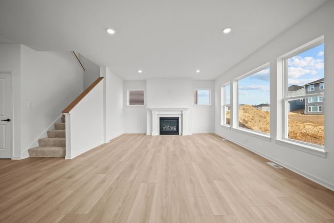 Natural light and 9' ceilings create a vast living space. | Image 6