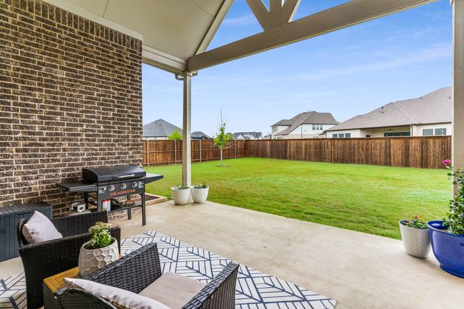 Backyard view from the covered patio | Image 34