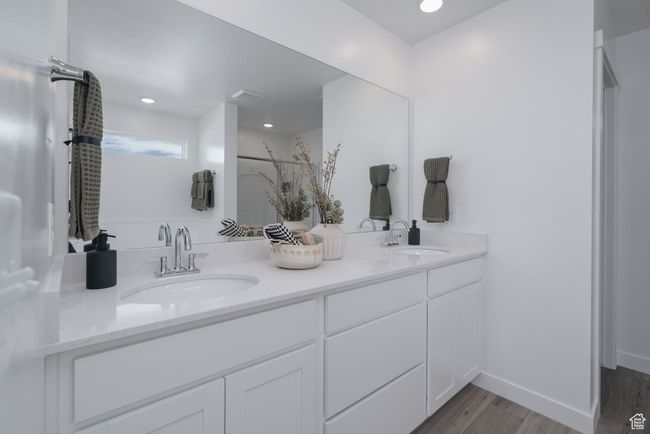 Full bathroom with double vanity, wood finished floors, and recessed lighting | Image 7
