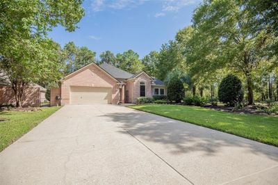 This stunning fully renovated single-story brick home. Private iron gate entrance with its own private courtyard & CASITA. Home offering 3 bedrooms, 3.5 baths, study, formal dining and huge cover patio with a two-car oversize garage, featuring a well-manicured lawn and mature trees, providing a serene and private setting. | Image 1