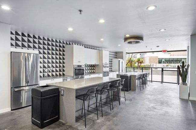 Common area with full kitchen, seating, and right near the pool! | Image 35