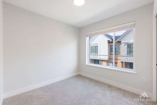 Carpeted empty room featuring baseboards | Image 21