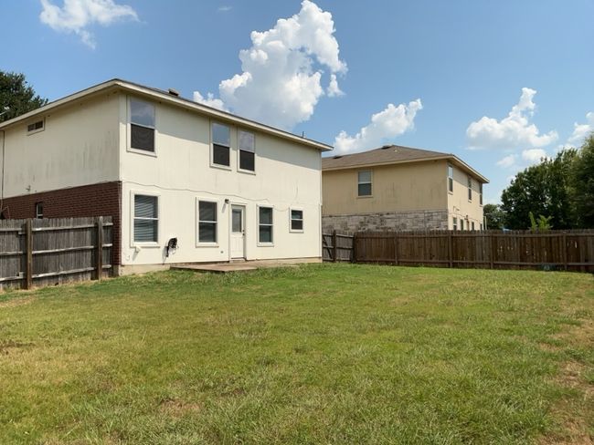 Rear view of house featuring a fenced backyard | Image 25