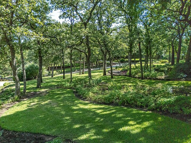 View of beautifully landscaped yard. | Image 38