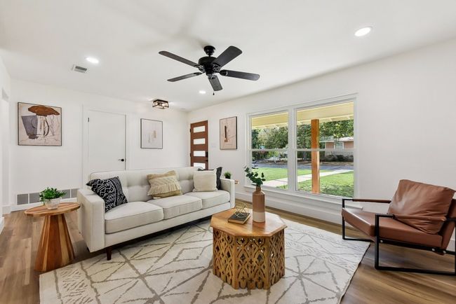 Living area featuring recessed lighting, light wood-style floors, and visible vents | Image 11