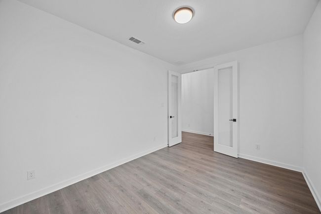 Spare room featuring wood finished floors | Image 16