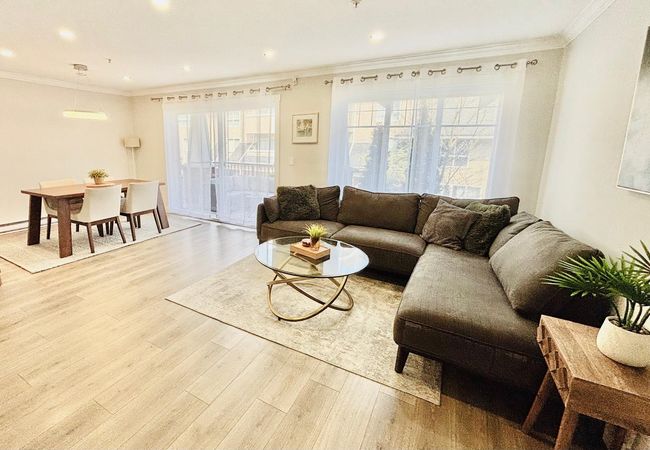 Living area with crown molding, wood finished floors, healthy amount of natural light, and recessed lighting | Image 6