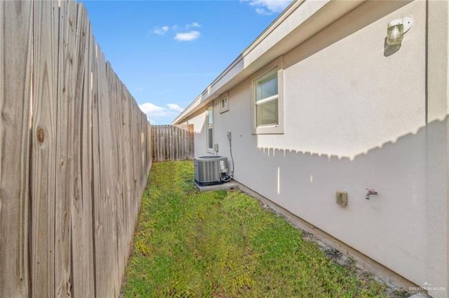 View of yard with central AC unit | Image 11