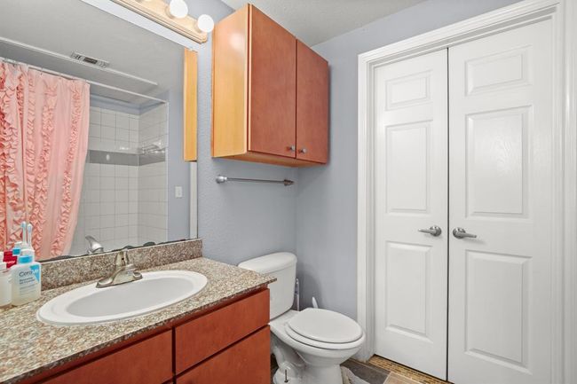 Bathroom featuring vanity and a shower with curtain | Image 16