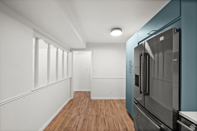 Corridor featuring light wood-style flooring and baseboards | Image 10