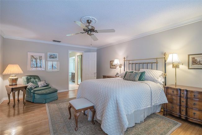 master bedroom with hardwood floors | Image 9