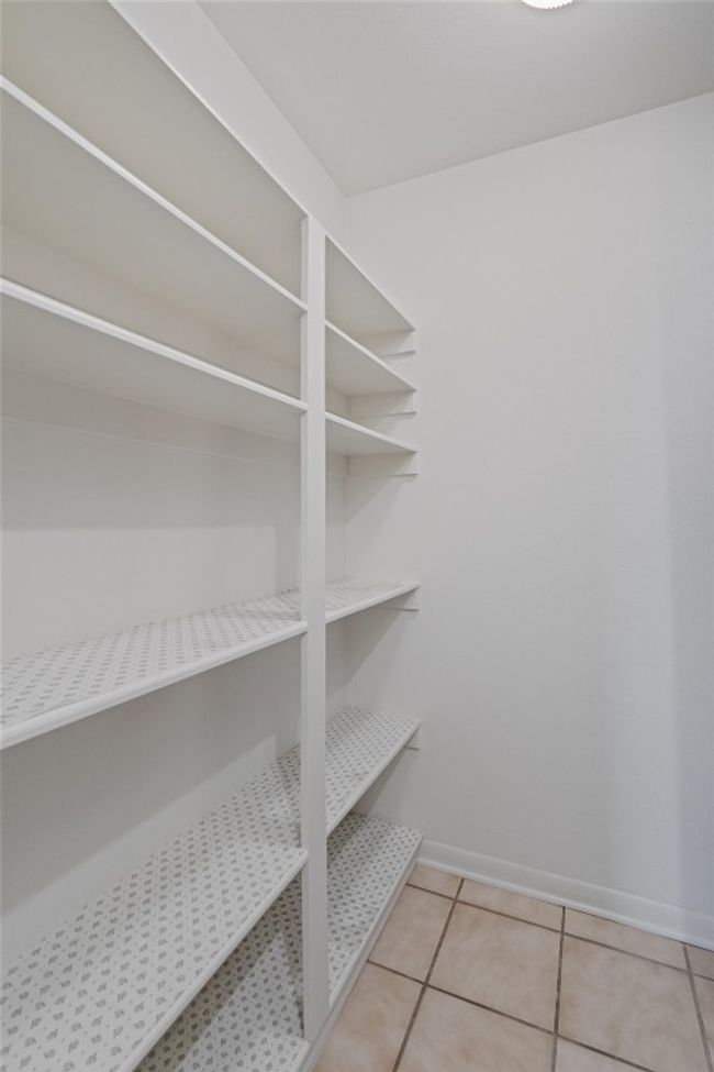 View of shelving in pantry but there is also another pantry providing loads of storage | Image 20