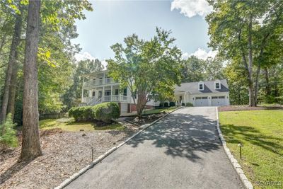 Wide paved driveway with lighting, leads you home! | Image 2