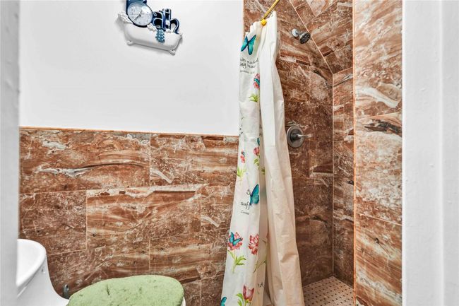 Full bath featuring toilet and a shower stall | Image 22