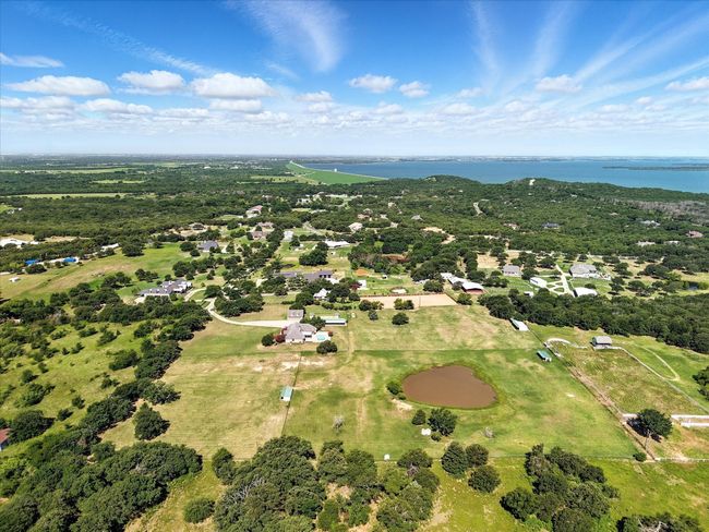 Aerial view of property and surrounding area featuring a nearby body of water | Image 32