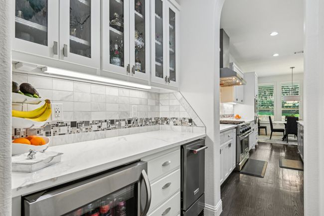 Butler's pantry with ice maker and beverage fridge | Image 14