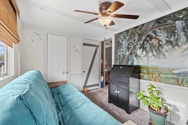 Carpeted living room with ceiling fan | Image 25