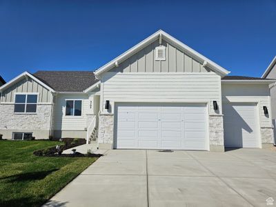 View of front of home with a garage and a front yard | Image 2