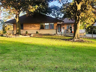 View of front of home featuring a front lawn | Image 1