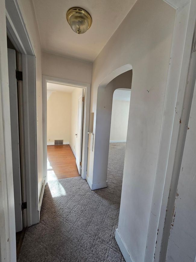 Main floor hallway to bedrooms & bath | Image 14