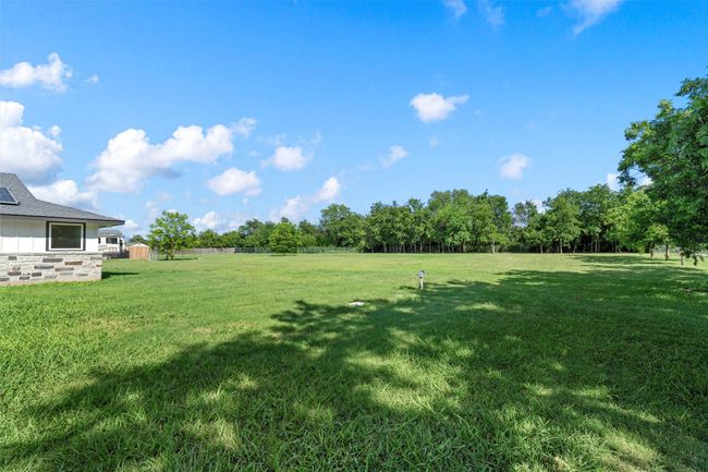 View of yard with a storage unit | Image 4