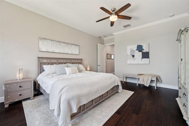 View of master bedroom with entrance from hallway to back left. | Image 45