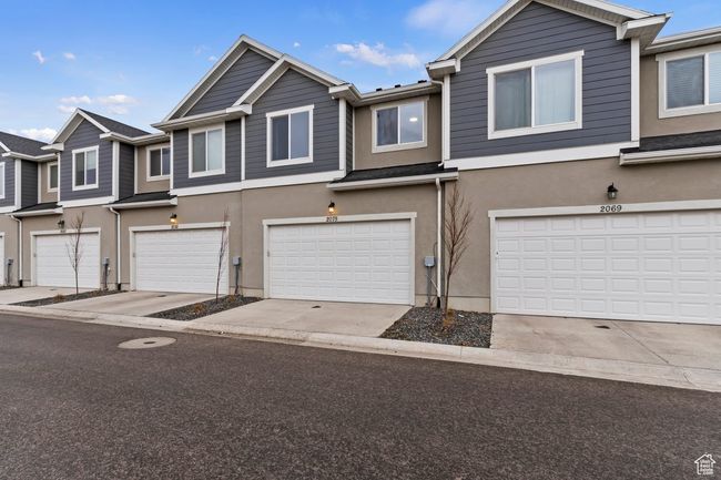 View of property with a garage | Image 21