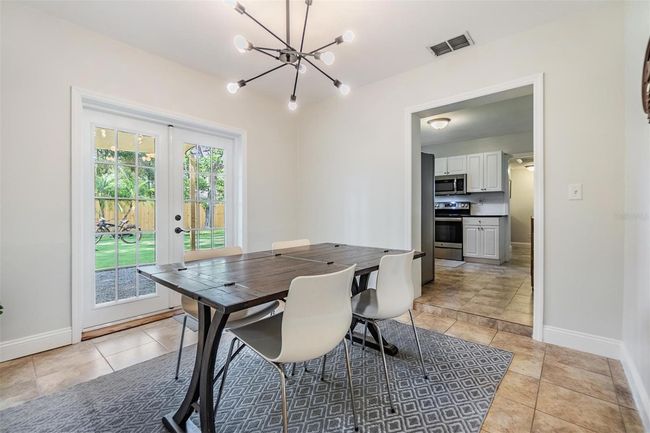 Dining room with French Doors leading to beautiful back yard oasis | Image 11