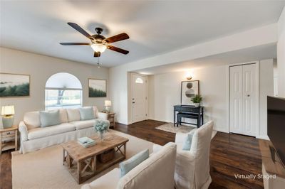 Living room featuring dark laminate wood floors | Image 3