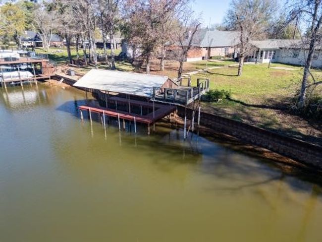 View of dock with a lawn and a water view | Image 10