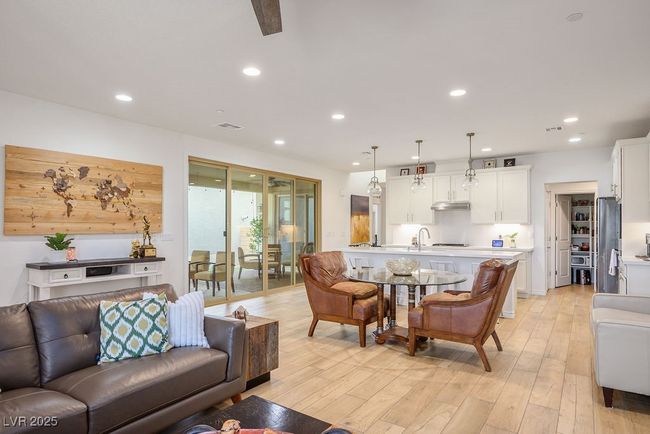 Living room with light wood-style floors and recessed lighting | Image 13