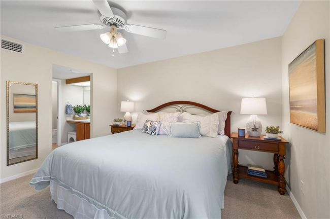 Carpeted bedroom with ceiling fan | Image 14