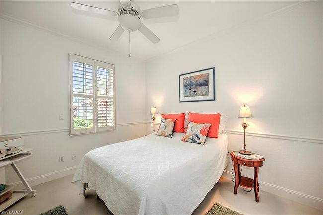 Carpeted bedroom featuring crown molding, baseboards, and ceiling fan | Image 17
