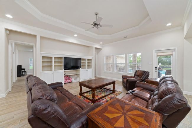 Nice-sized living room with built-ins. | Image 10
