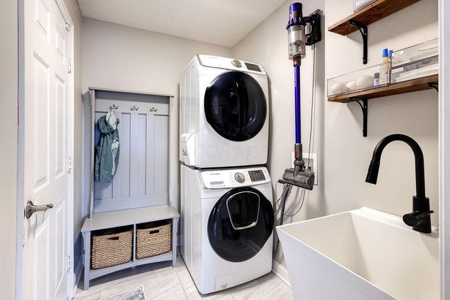 First floor laundry with utility sink. | Image 20
