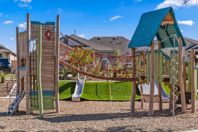 Playground located at The Lake House includes slides, monkey bars, climbing area, and swings! | Image 8