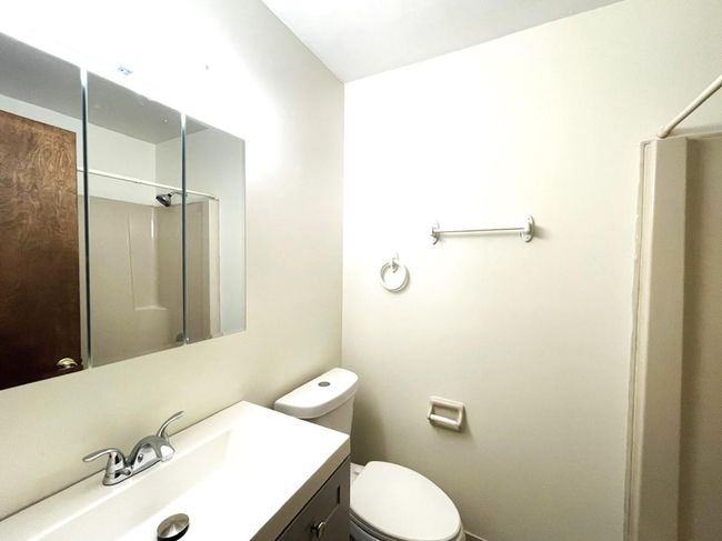 Bathroom with vanity and a shower | Image 21
