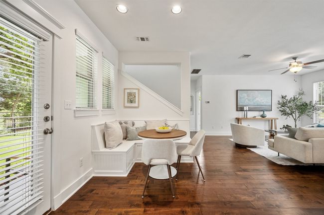 The built-in bench seat in the dining area creates a cozy, inviting space for quiet meals or casual gatherings | Image 17