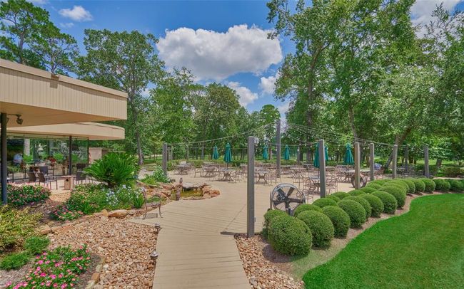 Cafe on the Green is one of several restaurants in the community. This one has outdoor seating overlooking the golf course- the perfect spot for an afternoon glass of wine or relaxing after a round of golf. | Image 44