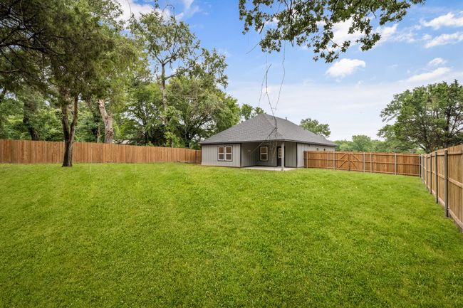 View of yard with a patio area. plenty of space to plant a garden or run and play. | Image 34