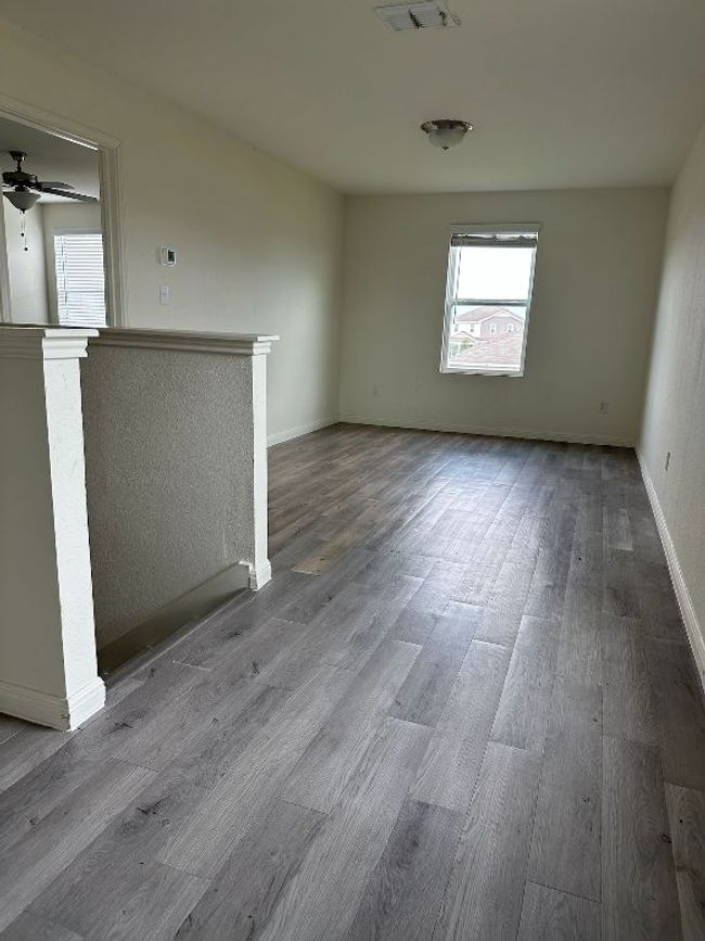 Unfurnished room with wood finished floors and a ceiling fan | Image 18