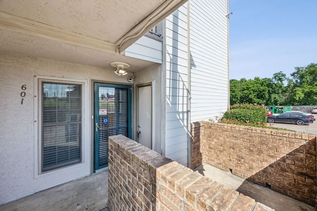 View of property entrance, storage closet and oversized front patio | Image 27