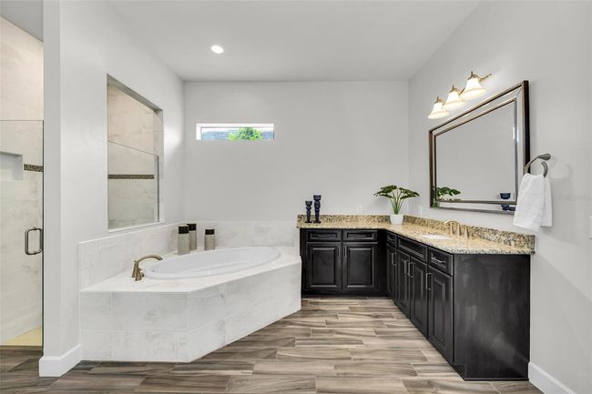 tub and l shaped vanity | Image 40