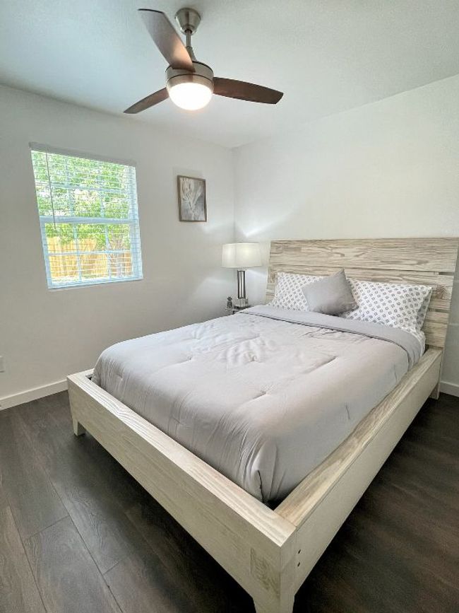 Bedroom featuring dark wood-style floors and a ceiling fan | Image 8