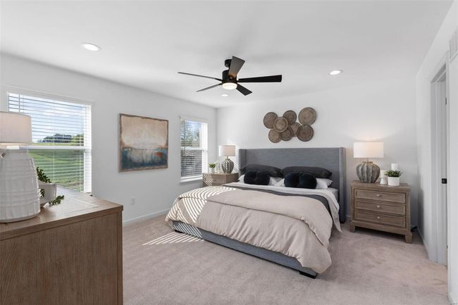 Carpeted bedroom with ceiling fan | Image 31