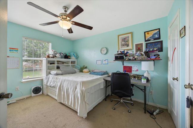 Bedroom featuring carpet floors, baseboards, and a ceiling fan | Image 20