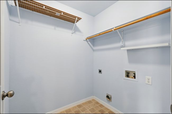 Washroom with laundry area, washer hookup, baseboards, and hookup for an electric dryer | Image 23