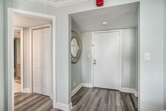 Entrance foyer featuring wood finished floors and baseboards | Image 5
